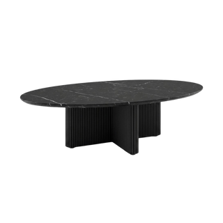 An oval black coffee table with a black marble top and a sculptural fluted pedestal base, shown on a solid white background.
